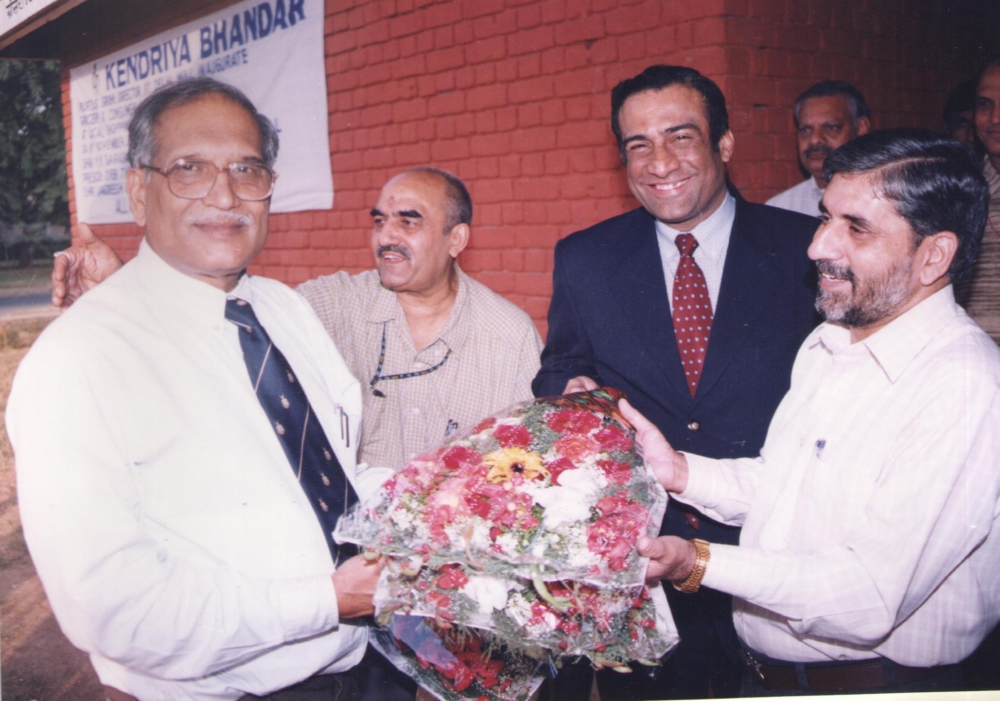 Photograph of former chairman with various dignatories